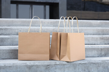 Paper bags on stairs outdoors. Food delivery service
