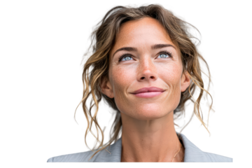A thoughtful woman with light brown, wavy hair gazes upward, exhibiting a serene and hopeful expression.