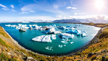 Icebergs in a turquoise lake under a bright sky