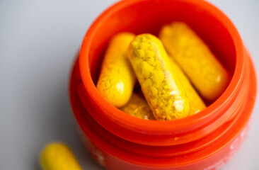 Close up of Orange Berberine Powder in Capsules