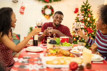 A family enjoys a festive Christmas dinner, sharing food and creating memories. A beautifully...
