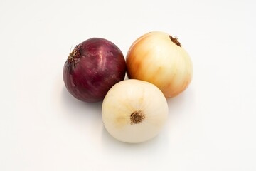 Assorted whole onions isolated on white background
