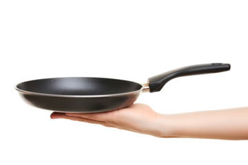 A hand holding a black frying pan kitchen cooking utensil