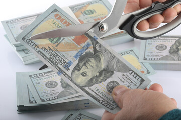 scissors and money on white background