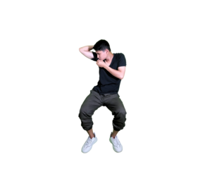 Funny Young Man Smelling His Armpit in Black T-Shirt on White Background