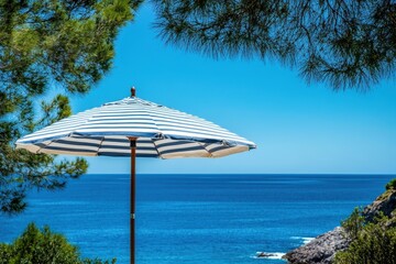 Striped blue umbrella is near the sea, under the sunny sky and trees. Perfect for illustrating summer vacations, sunny travel, or beach relax.