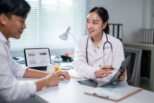 A woman doctor is talking to a man in a white shirt