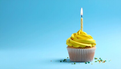 A single cupcake rests on a pale blue plane&mdash;its yellow frosting crowned by one striped candle, a miniature monument to intention. This is not a party&mdash;it&rsquo;s the memory of a wish.