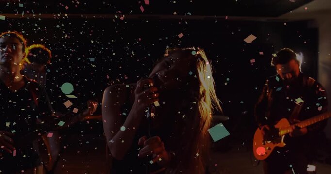 Singer matching beat leaning into mic tossing hair and confetti falling in music scene