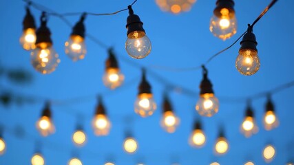 A cozy gathering unfolds in a beautifully adorned backyard as string lights warmly illuminate the night sky, creating a welcoming atmosphere filled with laughter and joy among friends.