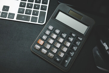 Calculator with Keyboard and Mouse on Office Desk. finance, accounting, office work, and modern technology tools used in business or home office settings. Blank calculator for text.