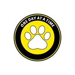 Circular Emblem with Paw Print and Inspirational Phrase.