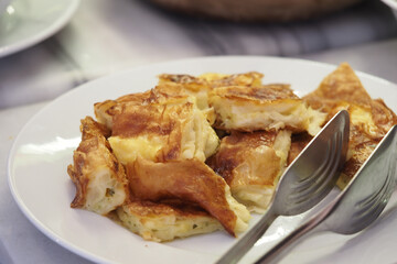 Delicious homemade savory pastry served on a white plate