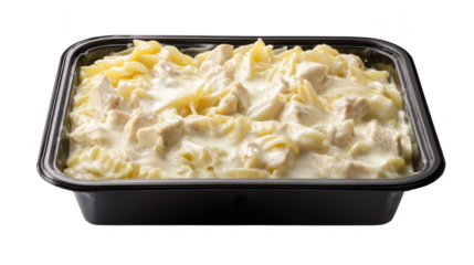 Delicious creamy chicken alfredo on a black background, classic italian pasta dish.