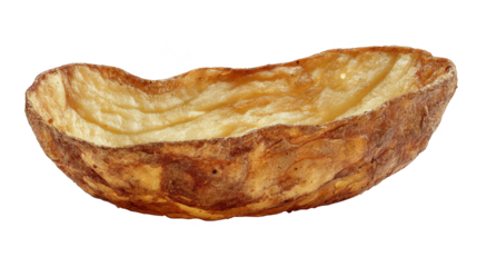 Closeup of a single potato on dark surface, study in texture and simplicity.