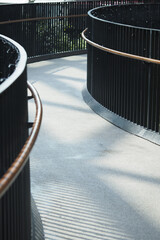 Curved pathway with railings in urban environment