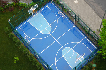 Basketball court overview in a park during midday
