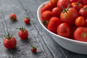 Fresh Red Tomatoes in White Bowl on Rustic Wooden Table