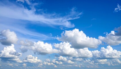 Vast blue sky with fluffy clouds