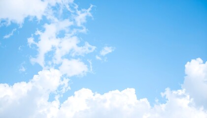 Light blue sky dotted with fluffy white clouds