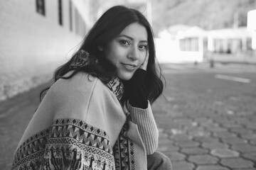 Fashion model wearing traditional andean poncho and scarf