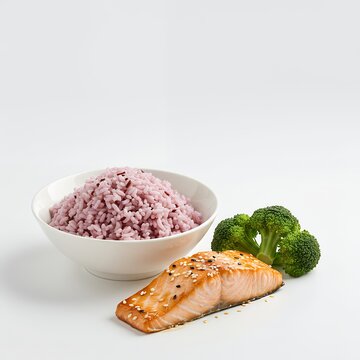 Riceberry rice served with salmon teriyaki and steamed broccoli, clean composition, isolated
