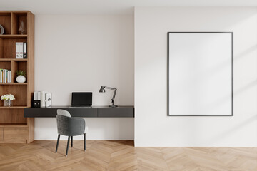 Modern home office interior with wooden bookshelves and framed poster on white wall