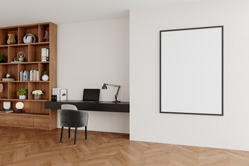Stylish home office with framed vertical artwork and extensive wooden shelving