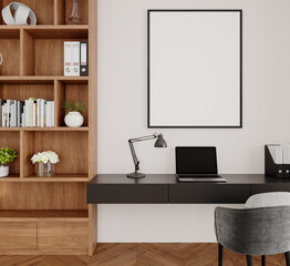 Close-up of modern desk with framed poster and bookshelf decor in home office