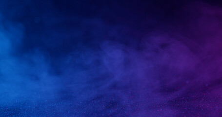 Vapor art. Shimmer texture. Defocused blue purple neon colorful ink in water haze flow fume flying on abstract dark black background.