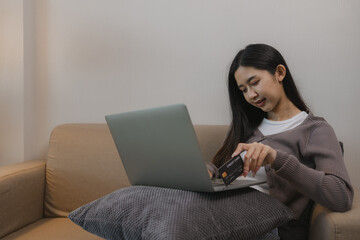 she is using a credit card for some transactions, pay with a credit card or debit card, the right...