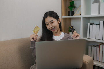 she enjoys shopping online by paying wit her credit card, the balance on her debit card is enough...