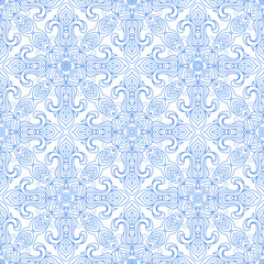 Damask Seamless pattern of blue ornate flowers and snowflakes on a white background