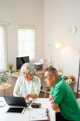 Senior couple with laptop for life insurance documents, home retirement planning or investment with online ecommerce website or banking. Elderly people with tax paperwork, pension or asset management.