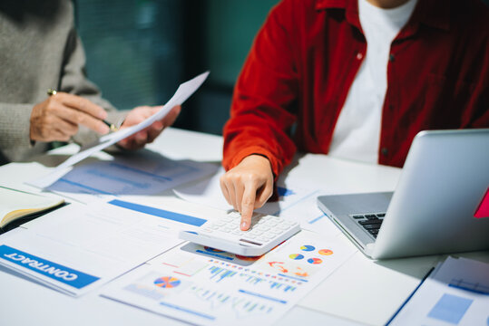 Business team meeting. professional investor working new start up project. Finance task. with smart phone and laptop - Powered by Adobe