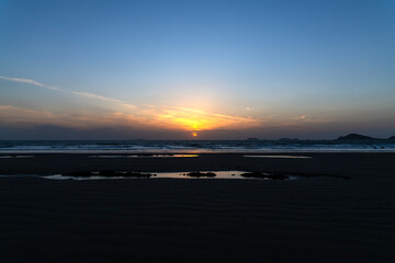 sunset over the sea in winter