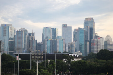 Obraz premium A high resolution image of modern skyscrapers and office towers in Jakarta central business district, Indonesia. The photo showcases glass covered buildings under a dramatic cloudy sky, representing t