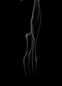 Graceful white smoke flowing against a black background in a vertical video format, ideal for abstract effects, transitions, or content related to cigarette smoke