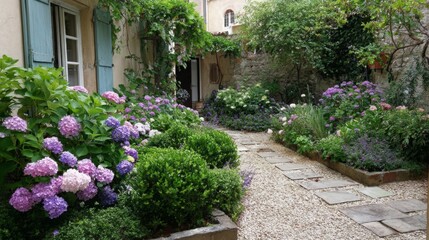 Fototapeta premium Beautiful blooming garden with hydrangeas in a serene courtyard setting during daytime