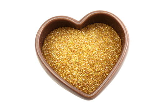 a heart shaped bowl filled with gold glitter