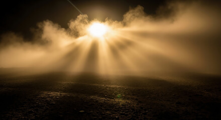 Obraz premium Sun shining through mist or smoke over dark earthy ground. Nature light effect and atmospheric phenomenon. Natural environment and outdoor landscape concept