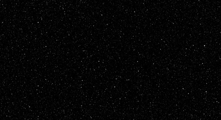 Dark background with scattered tiny light specks