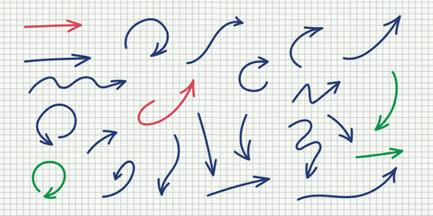 Hand drawn arrows including curved, straight, zigzag, and circular designs in blue, red, and green for use in graphics and diagrams on notebook grid paper background.