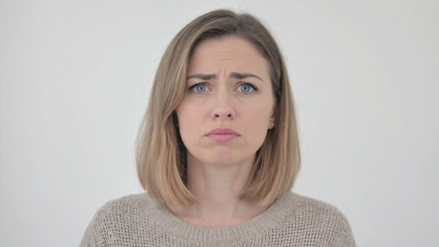 Anxious Reflection: A close-up portrait showcases a woman's face, her expression radiating concern and uncertainty. Her eyes reveal vulnerability. 