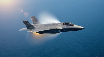 F-35 Lightning II Soaring Above the Ocean with Vapor Cone and Afterburner