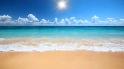 Fototapeta premium Ocean waves lapping a sandy beach under a bright sun and blue sky.