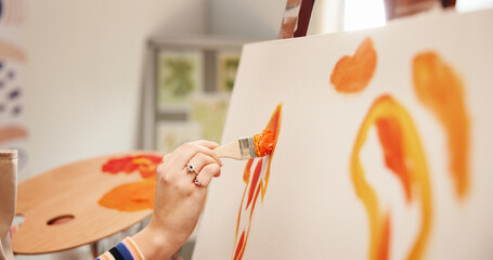 Hand, painter and stroke on canvas at workshop, color or creative process with design for artwork....