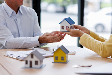 Estate business agent giving house Real estate transaction with agent giving house keys to client...