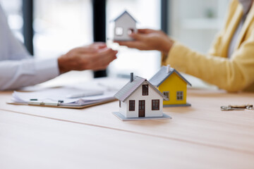 Estate business agent giving house Real estate transaction with agent giving house keys to client...