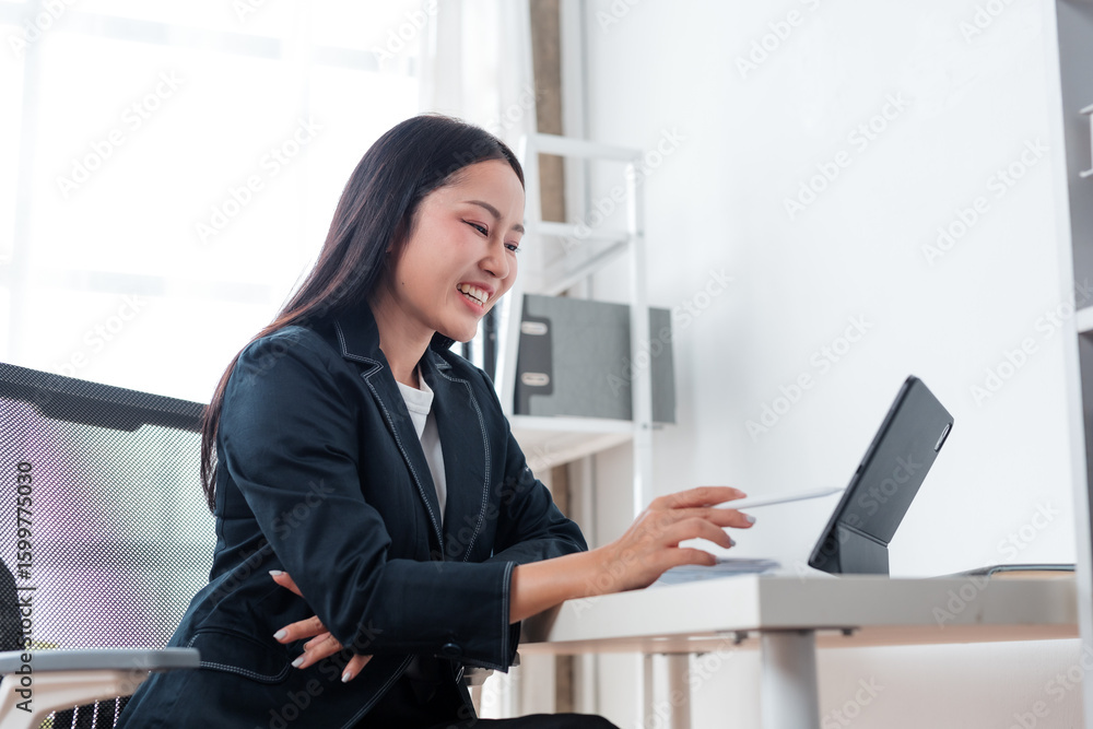 Poster young asian manager utilizing modern technology for various business tasks, experiencing enjoyment i